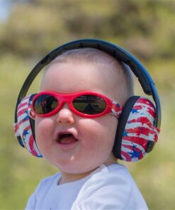Baby with sound reducing headphones